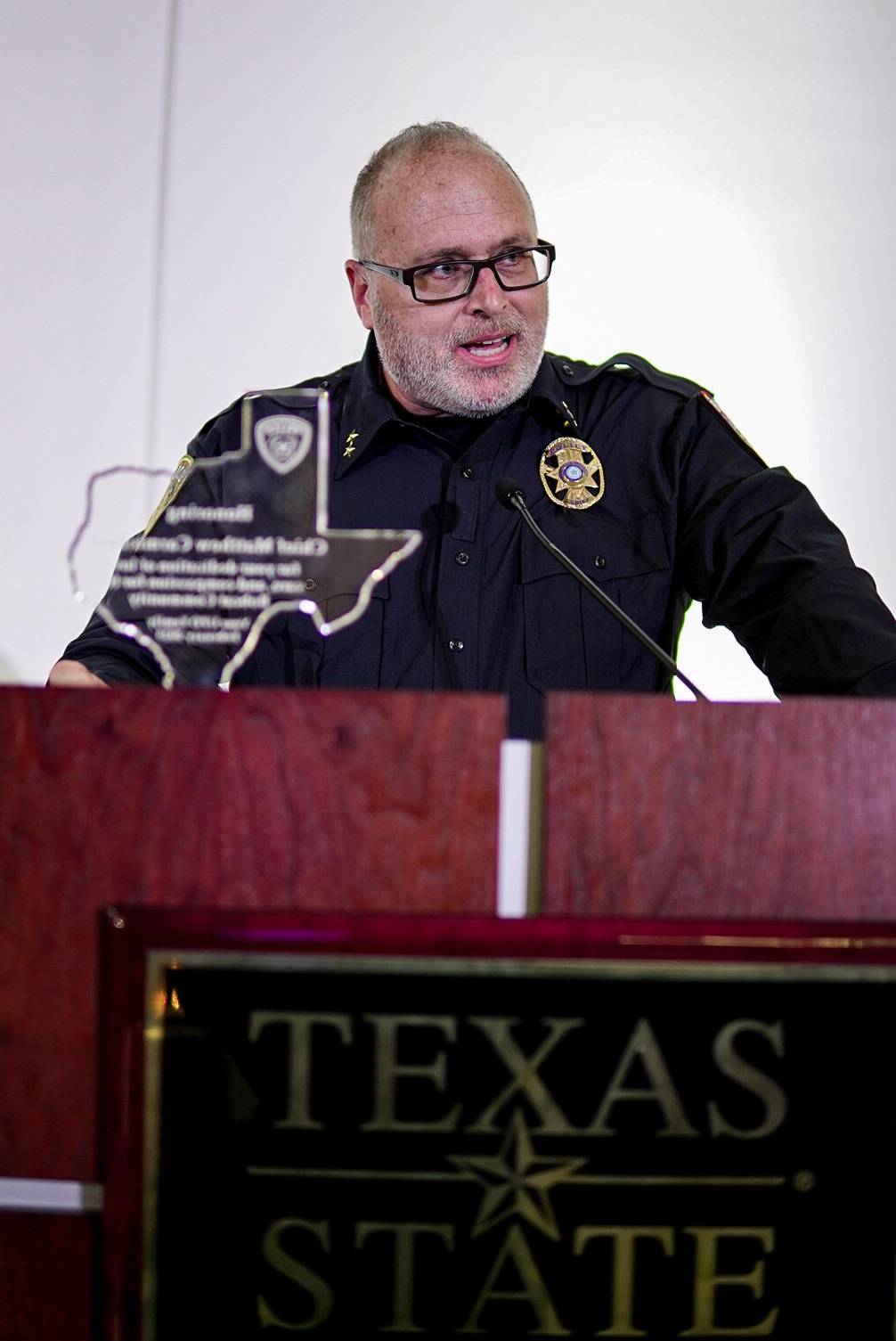 police chief standing behind podium